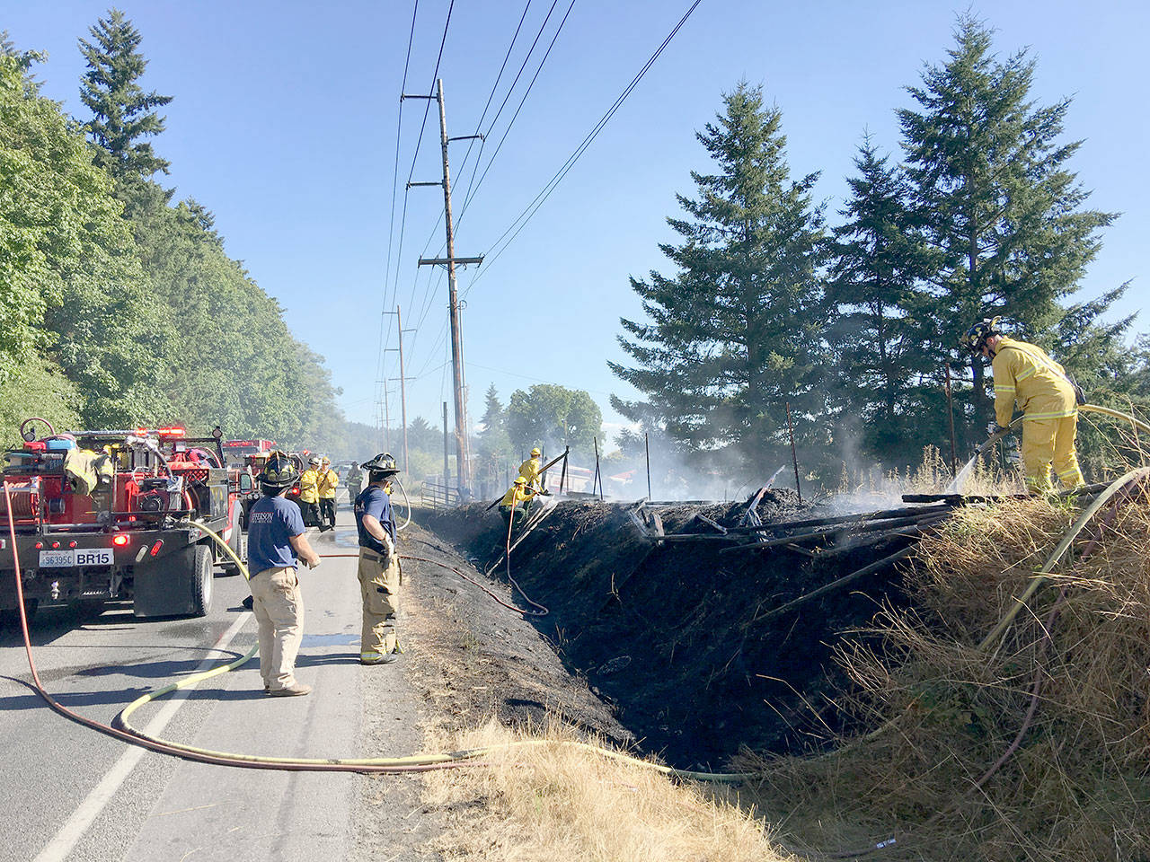Bill Beezley/East Jefferson Fire-Rescue A small grass fire shut down state Highway 19 while crews doused the area. The fire was likely sparked accidentally by a cigarette thrown from a passing vehicle, officials said.