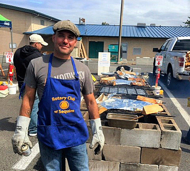 Rotarian Joe Irvin takes a break from preparing salmon at the annual Salmon Bake & BBQ on Aug. 13.