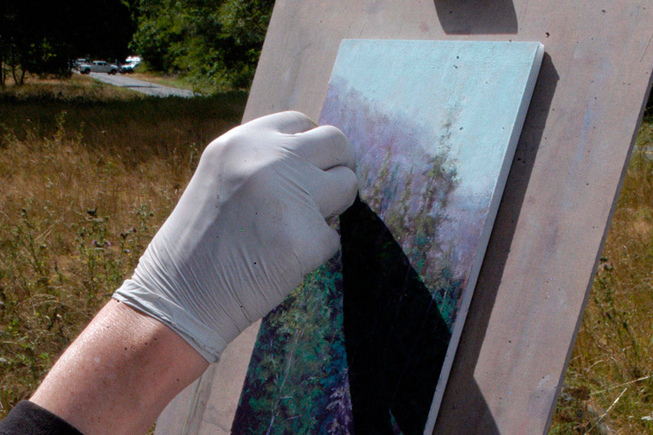 En plein air artist captures meadow scene at her easel