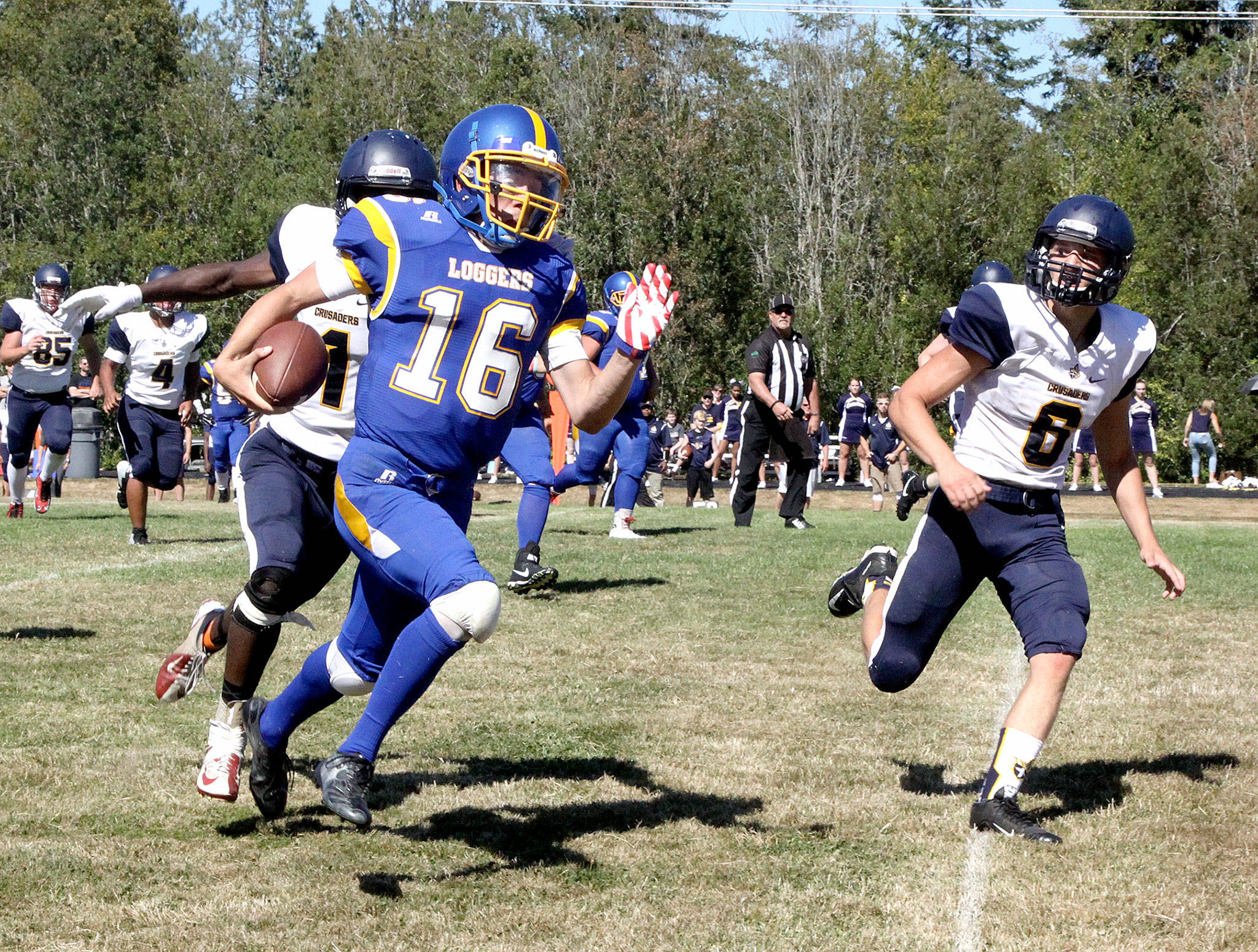 Crescent’s KC Spencer runs the ball against Tacoma Baptist on Saturday in Joyce. Crescent put a big scare into the Crusaders, one of the top 1B teams in the state, in a wild 78-64 loss. (Dave Logan/for Peninsula Daily News)
