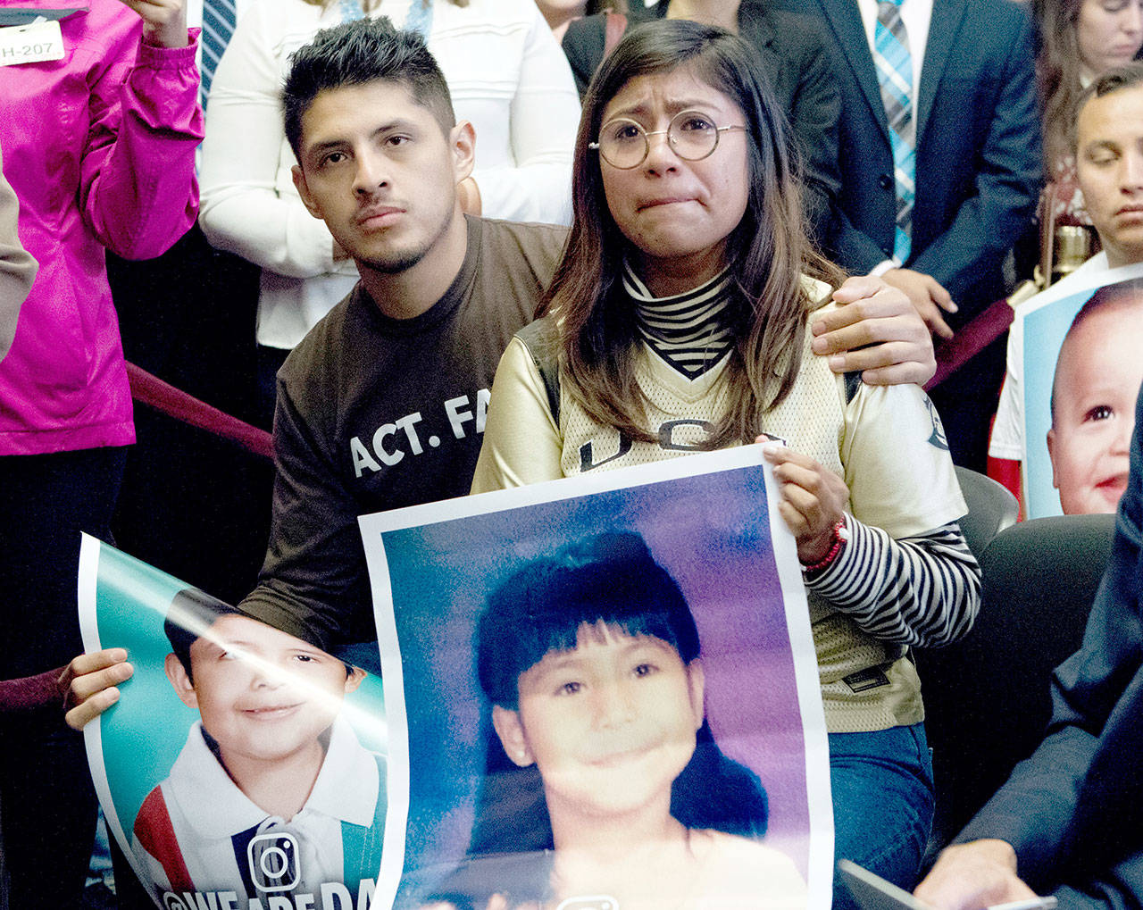 Dreamers Karen Caudillo, 21, of Florida is comforted by Jairo Reyes, 25, of Rogers, Ark., as Sen. Kamala Harris, D-Calif., accompanied by members of the House and Senate Democrats, speaks during a news conference on Capitol Hill in Washington, D.C., on Wednesday. House and Senate Democrats gather to call for Congressional Republicans to stand up to President Trump’s decision to terminate the Deferred Action for Childhood Arrivals (DACA) initiative by bringing the DREAM Act for a vote on the House and Senate Floor. (Jose Luis Magana/The Associated Press)