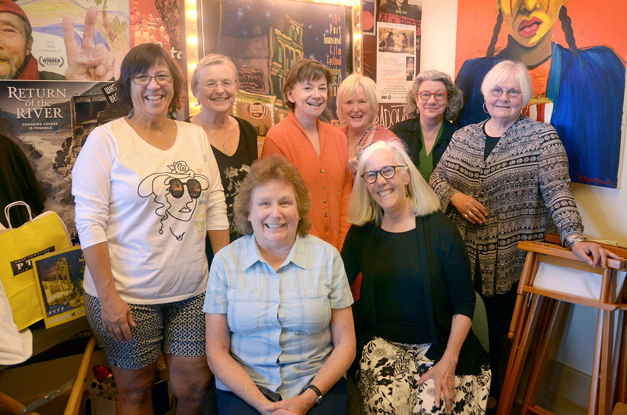 Staff and volunteers — in back from left, Carol Jorgensen, Chris McFaul, Nancy Rohl, Jan Halliday, Victoria O’Donnell and Cheryl Lopez; in front from left, Donna Bodkin and festival Executive Director Janette Force — gear up for the 18th annual Port Townsend Film Festival, which kicks off Friday morning. (Cydney McFarland/Peninsula Daily News)