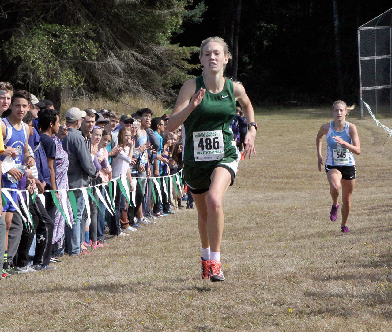 PA’s Gracie Long finishes first in the girls varsity race holding off Ellie Erikson of Interlake int he final stretch. (Dave Logan/for Peninsula Daily News)
