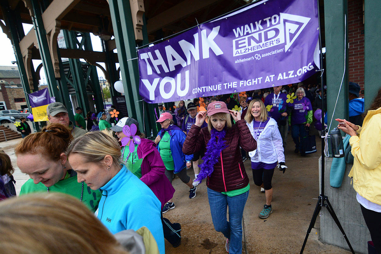 Participants in the Walk to End Alzheimer’s start in downtown Port Angeles on Sunday. (Jesse Major/Peninsula Daily News)