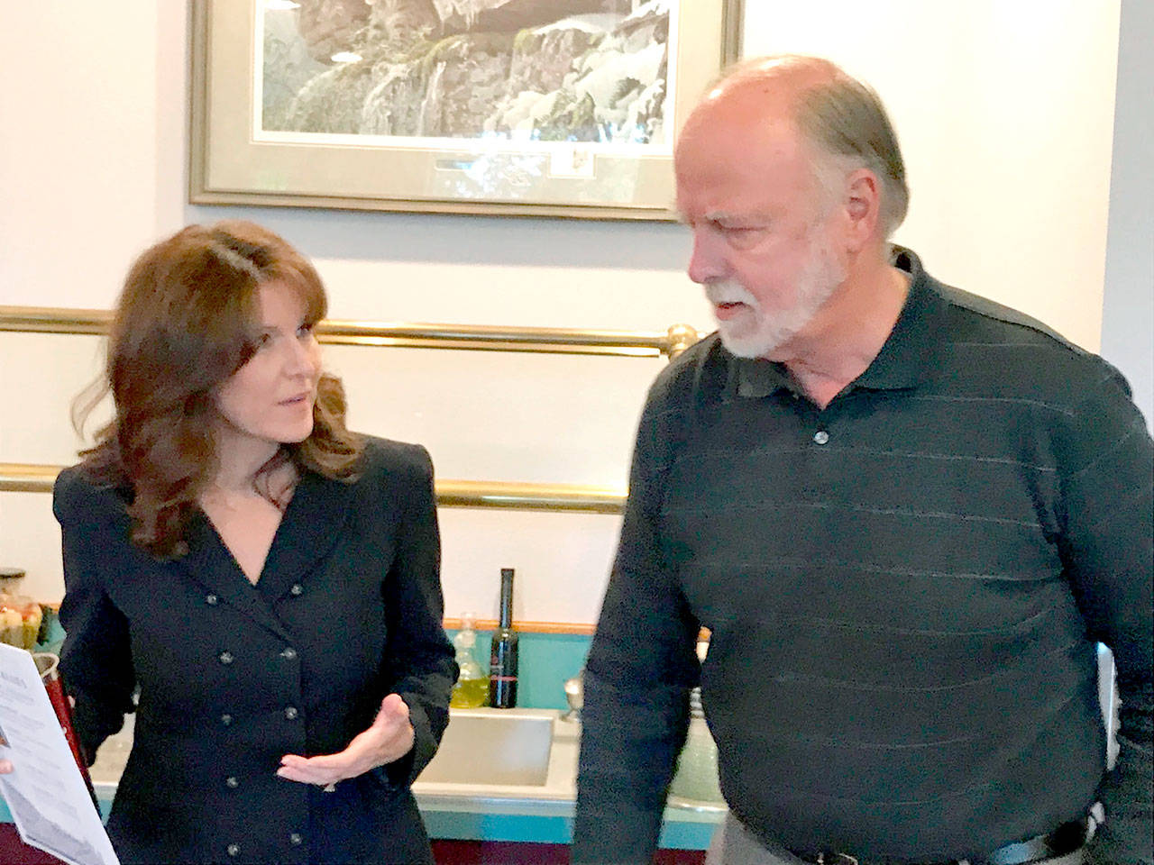Port of Port Angeles commissioner candidates Colleen McAleer and Michael Cobb speak after their election forum Tuesday. (Paul Gottlieb/Peninsula Daily News)