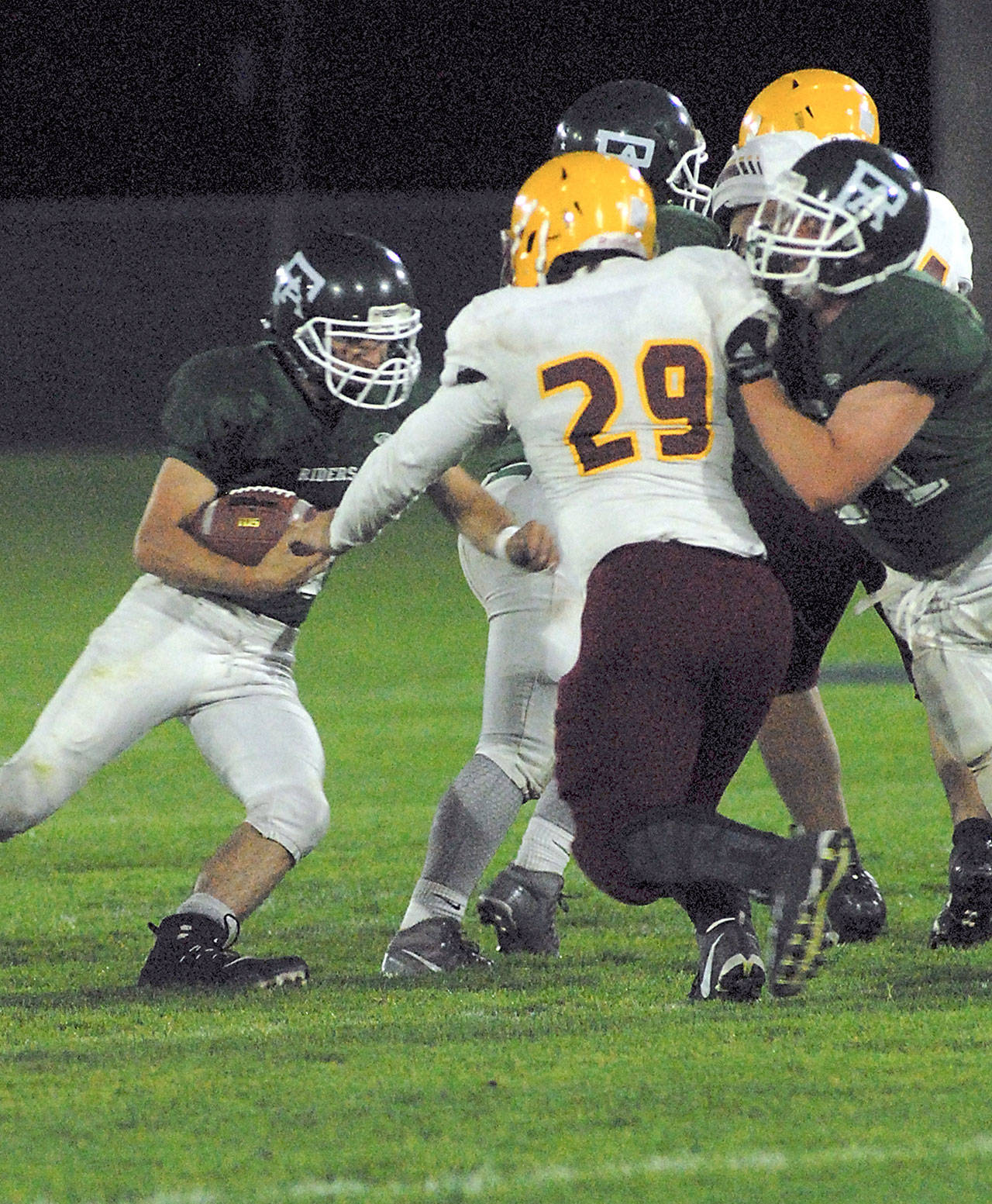 Keith Thorpe/Peninsula Daily News Port Angeles’ Jarret Burns, left, looks for an opening duing the first quarter on Friday night at home.