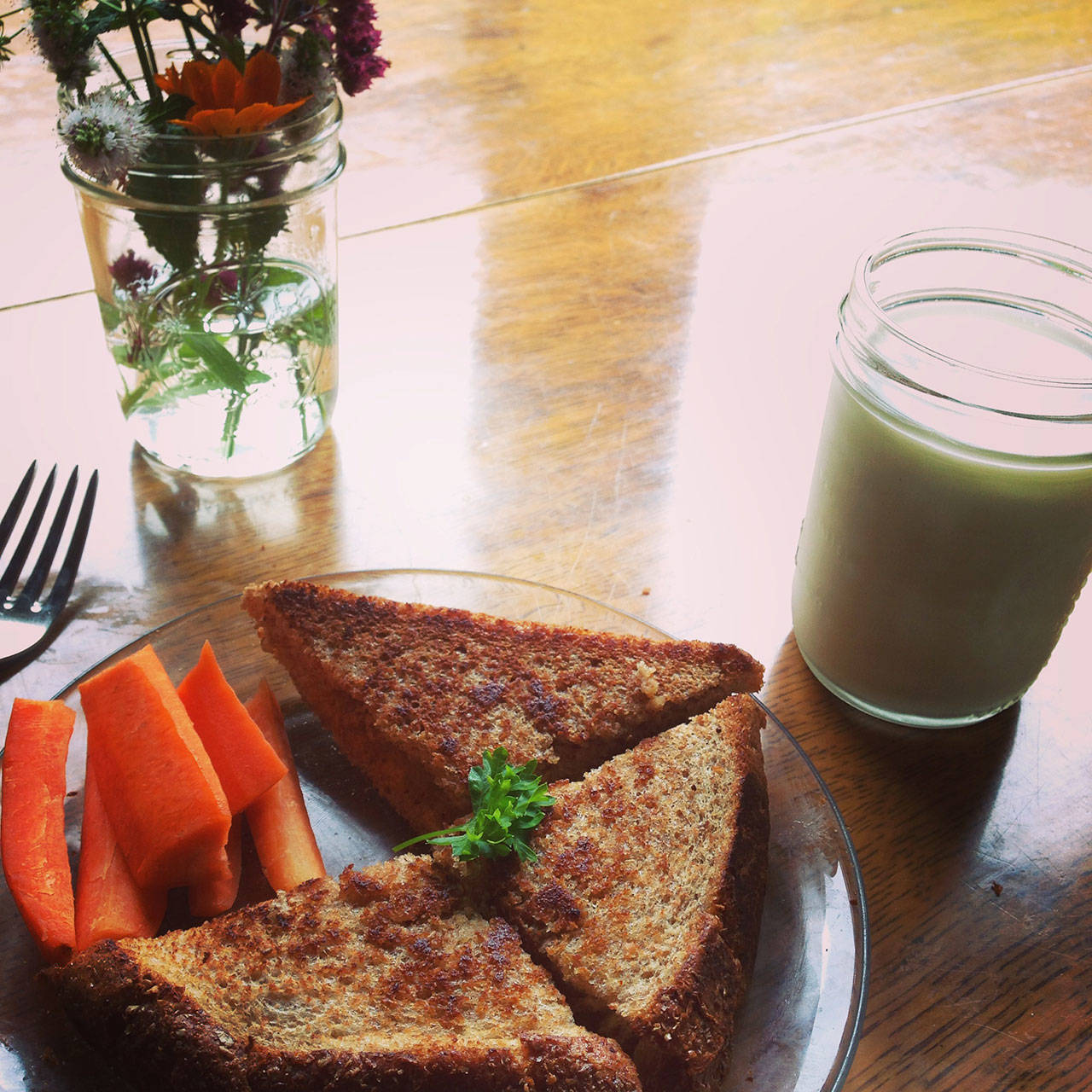 A grilled cheese sandwich sits waiting for a bowl of tomato soup. (Carrie Sanford/for Peninsula Daily News)