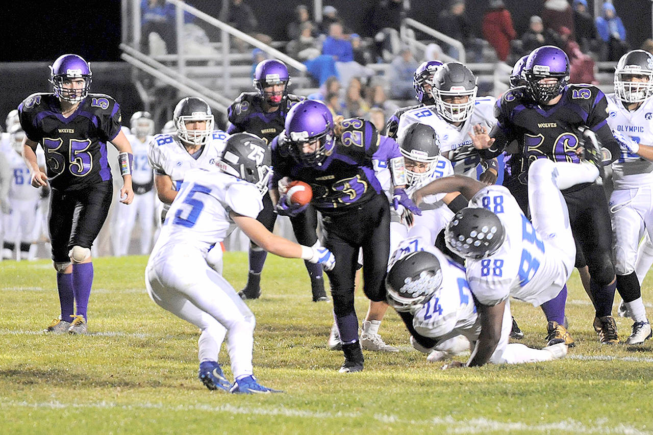 Sequim’s Gavin Velarde scored two second half touchdowns as the Wolves pushed past Olympic in the second half for a 31-18 win. Matthew Nash/Olympic Peninsula News Group