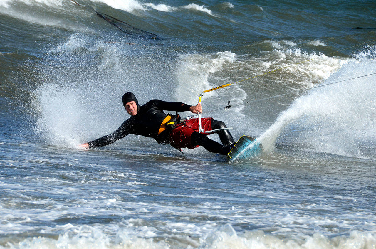 Tuesday’s winds didn’t bother local kite boarders as they flocked to North Beach in Port Townsend after the rain cleared to enjoy the sun and surf. (Cydney McFarland/Peninsula Daily News)