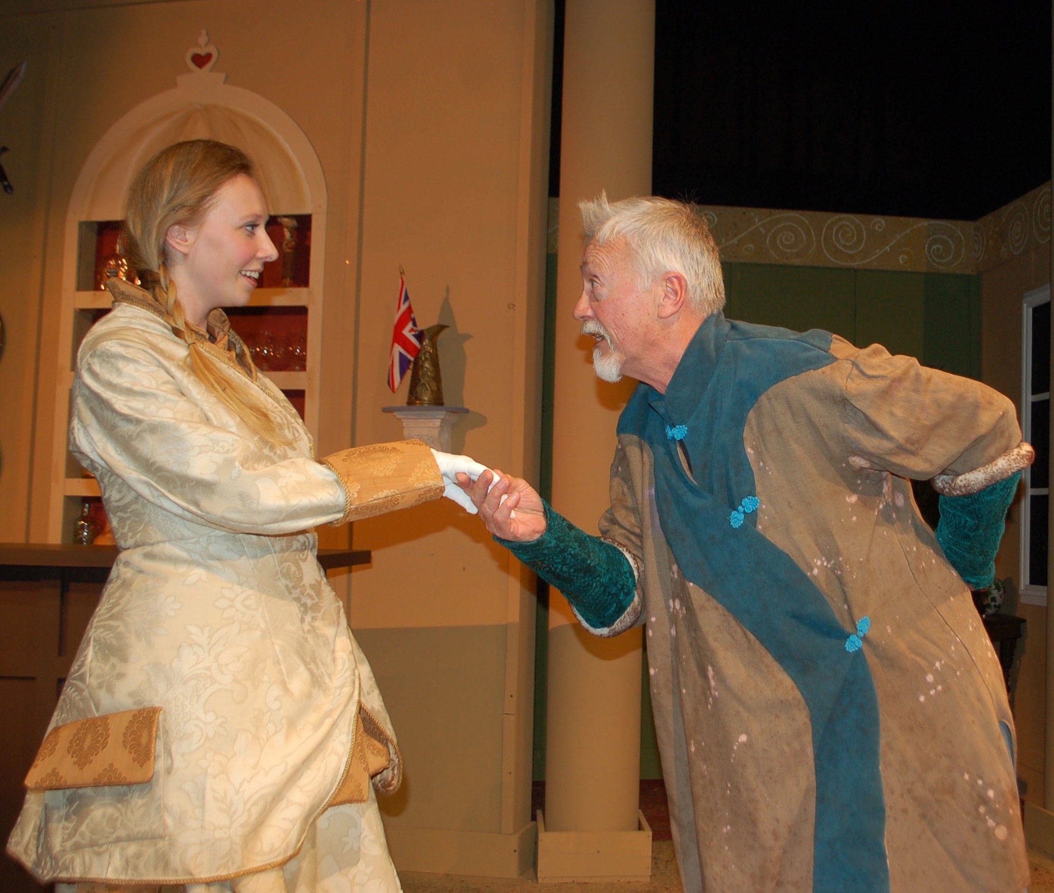 Liz Duvall cast as Phyllida Spotte-Hume and her twin, Countess Glamorgan, and Greg Scherer playing the part of President Harry Percy act out a scene from the upcoming play “The Explorer’s Club,” which will run from today through Nov. 5 at Olympic Theatre Arts. (Erin Hawkins/Olympic Peninsula News Group)