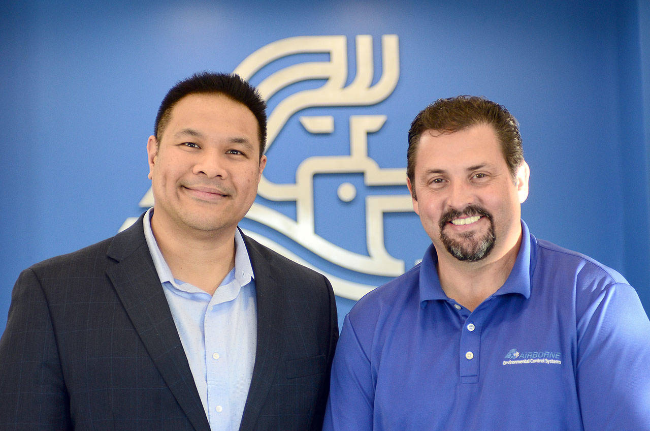 Raytheon Integrated Product Team Lead Clyde Campos, left, with Airborne Environmental Control Systems CEO Bill Lee in Port Angeles on Thursday. Campos said he anticipates a long-term relationship between Raytheon and Airborne ECS. (Jesse Major/Peninsula Daily News)