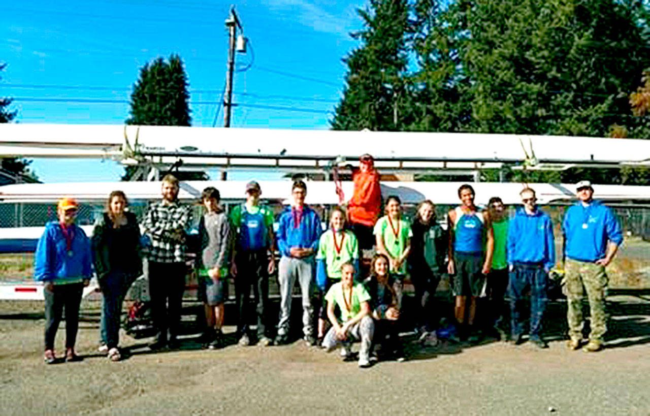 The Olympic Peninsula Rowing Association at American Lake in Lakewood. In front, kneeling, from left, are Lica Kennedy and Lisa Martin. Back row, from left, are Veronica Kennedy, Maria England, Jake McGovern, Skittles Pavlak, Tyler Turner, Harrison Fulton, Shannon Callahan, Jack Feingold, Ella Ventura, Emily Sirguy, Nathan Mishler, Aiden Feingold, Daniel Weaver and Calum Swinford.