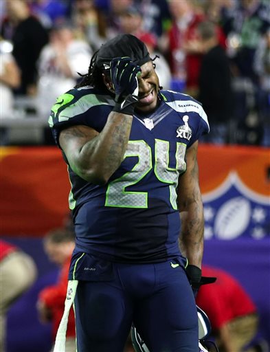 Seattle Seahawks running back Marshawn Lynch reacts to the interception that sealed the Seahawks 28-24 loss to the New England Patriots in the NFL Super Bowl XLIX football game in Glendale