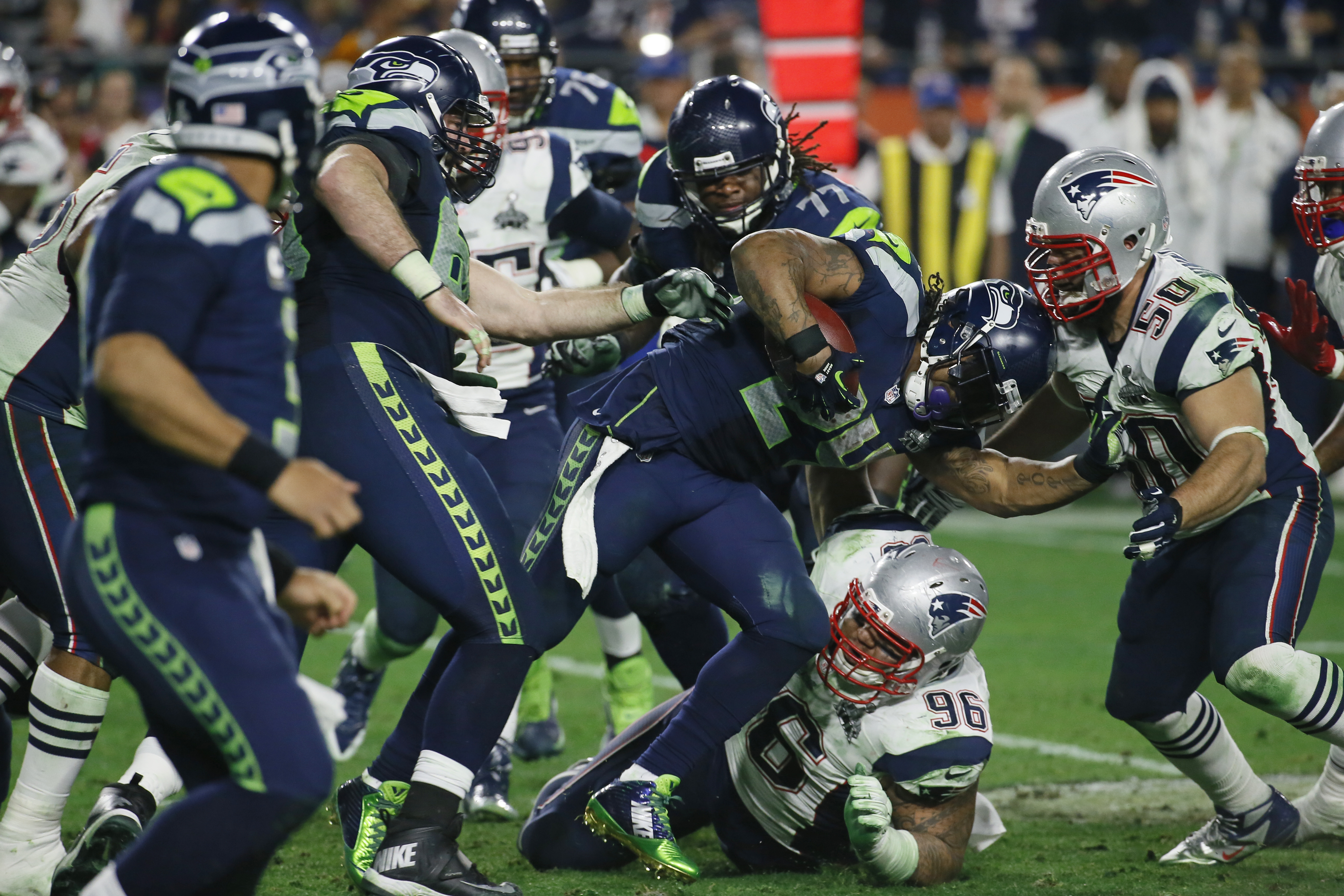 Seattle Seahawks running back Marshawn Lynch (24) gets tackled during the second half of Super Bowl XLIX last month. (The Associated Press)