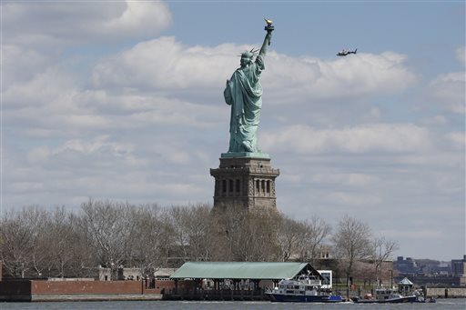 New York police boats are docked at Liberty Island when the Statue of Liberty was evacuated (The Associated Press)