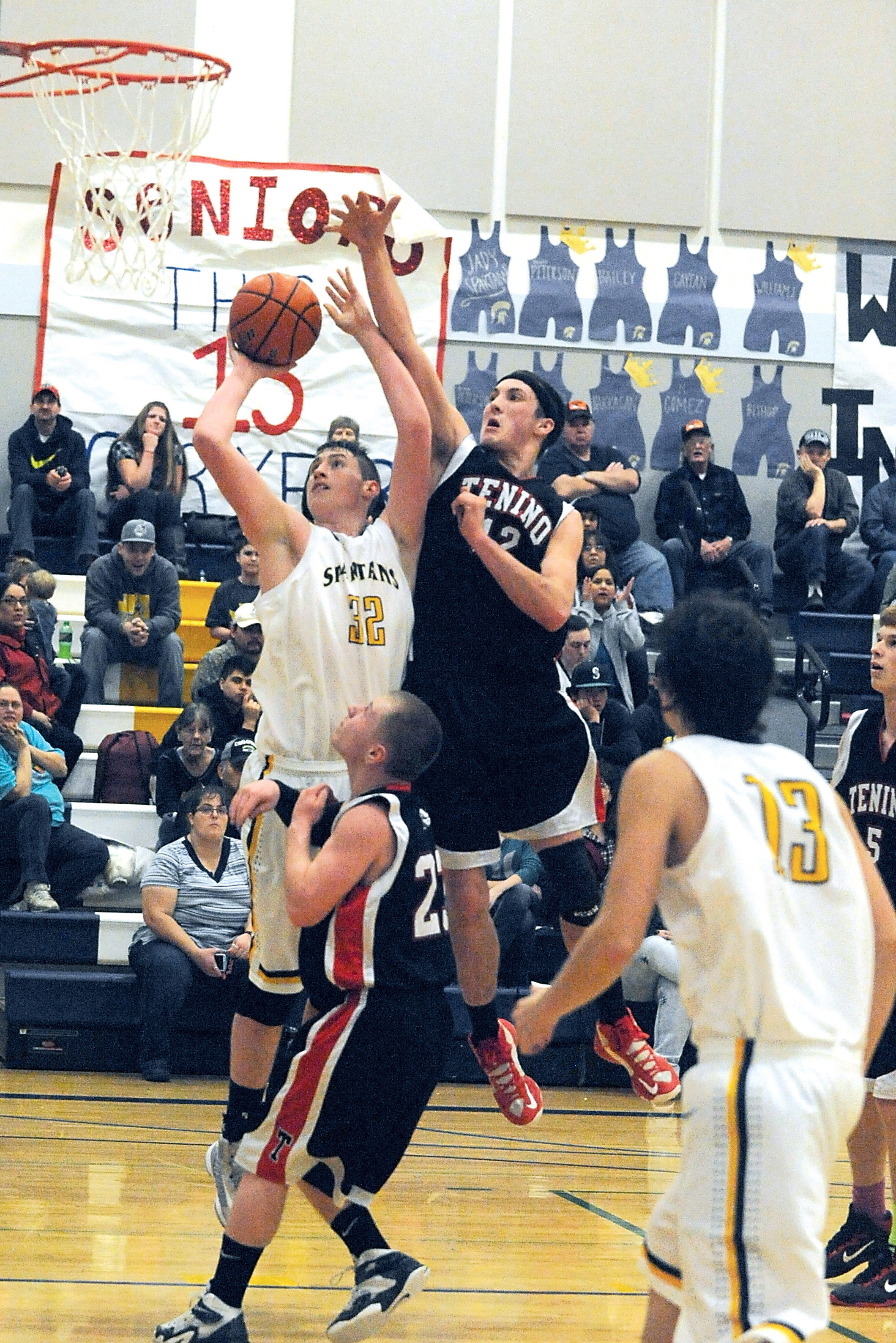 Forks' Marky Adams scores against Tenino's Thomas Pier (23) and Nihls Peterson (12). (Lonnie Archibald/for Peninsula Daily News)