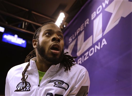 Seattle Seahawks' Richard Sherman answers questions during Media Day on Tuesday. (The Associated Press (Click on photo to enlarge))