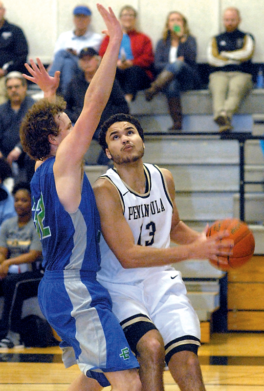 Peninsula's Malik Mayeux ducks into the lane around the defense of Edmonds' Devin Price. Mayeux led the Pirates in scoring with 16 points. (Keith Thorpe/Peninsula Daily News)