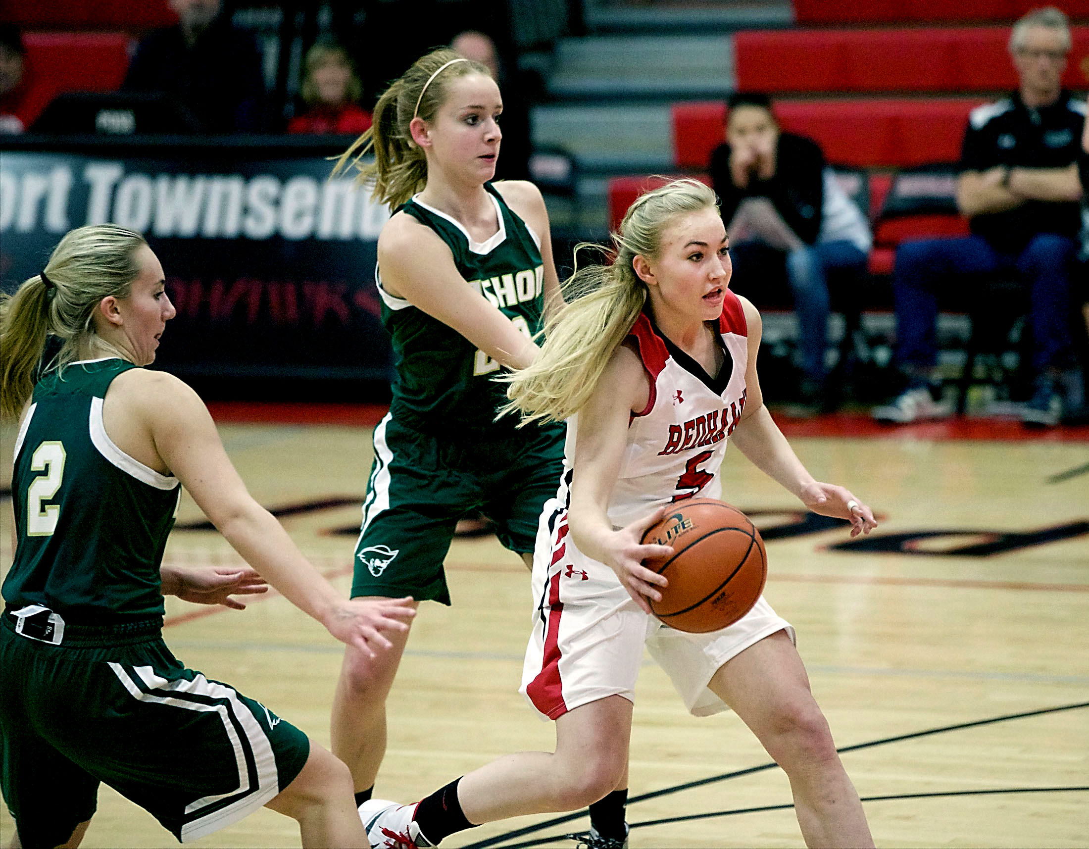 Port Townsend's Kaitlyn Meek drives past Vashon's Olivia Larson