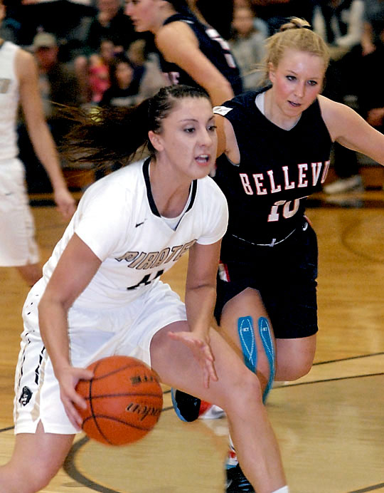 Peninsula's Cierra Moss tries to outrun Bellevue's Hannah Szendre. (Keith Thorpe/Peninsula Daily News)