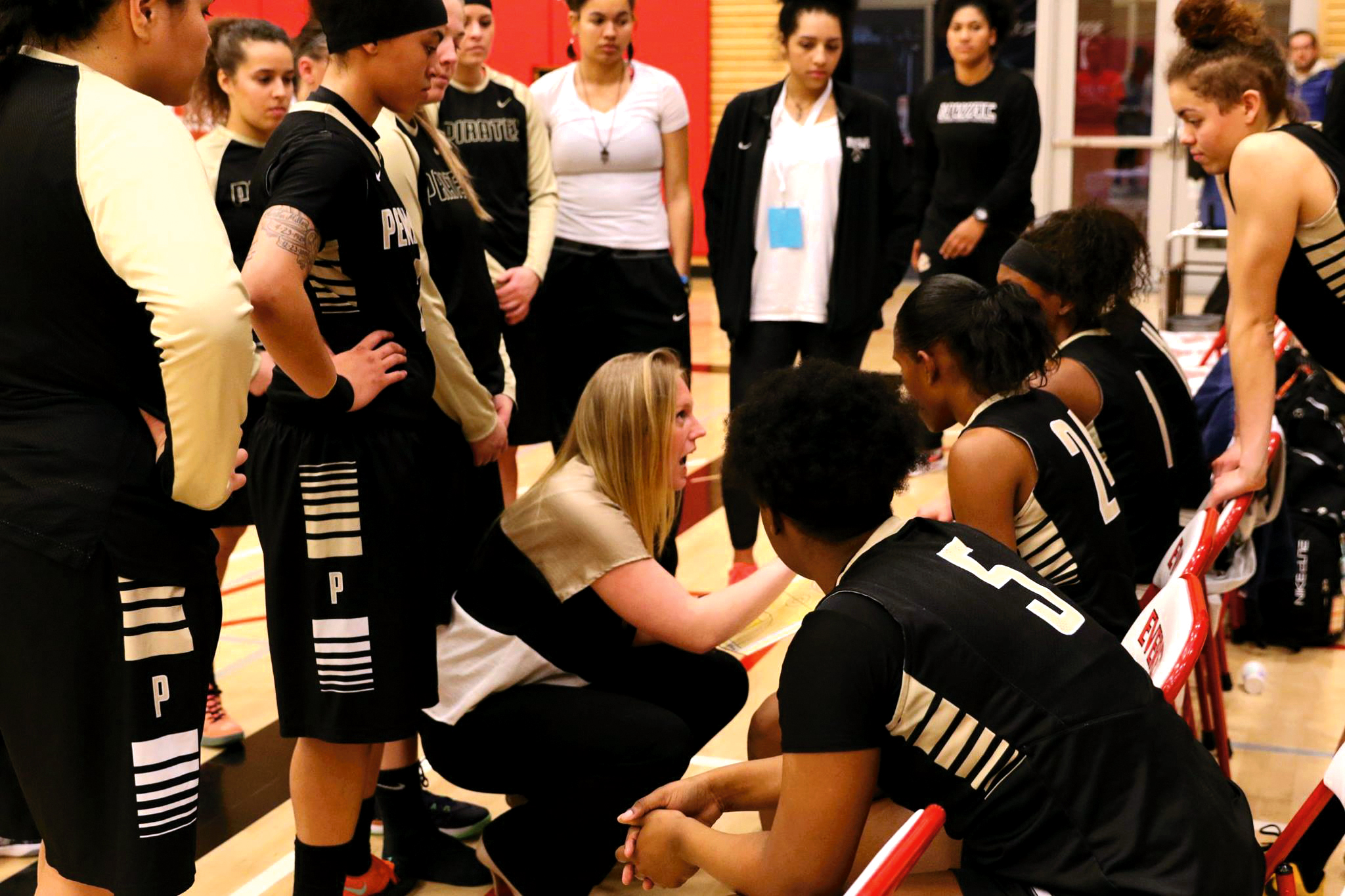 Peninsula coach Alison Crumb huddles