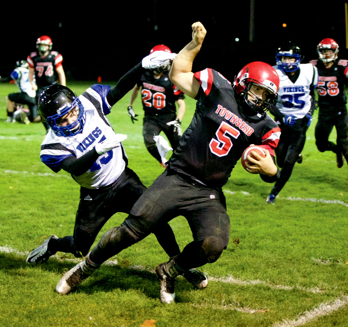 Port Townsend's David Sua gets pushed out of bounds after picking up a first down during the Redhawks' postseason victory over Bellevue Christian. In his only season starting at quarterback