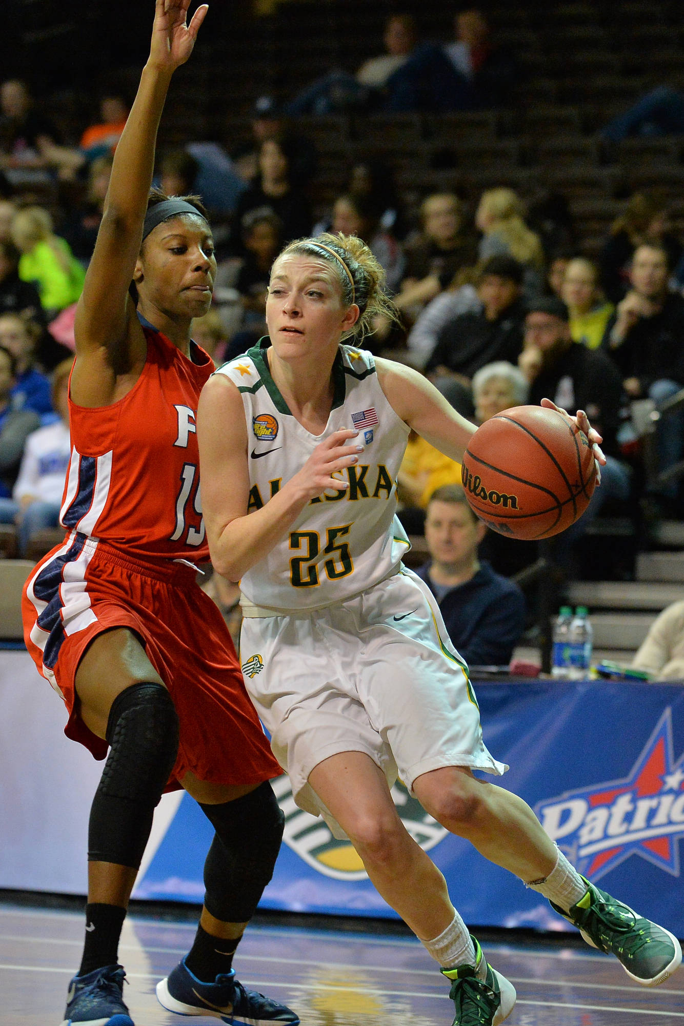 Alaska-Anchorage's Jessica Madison (25) drives against Francis Marion's Khayani Chandler during the Seawolves' 79-55 win over the Patriots in the NCAA Division II Elite Eight. Madison is a 2011 graduate of Port Angeles High School. (Sam Wasson/University of Alaska-Anchorage Athletics)