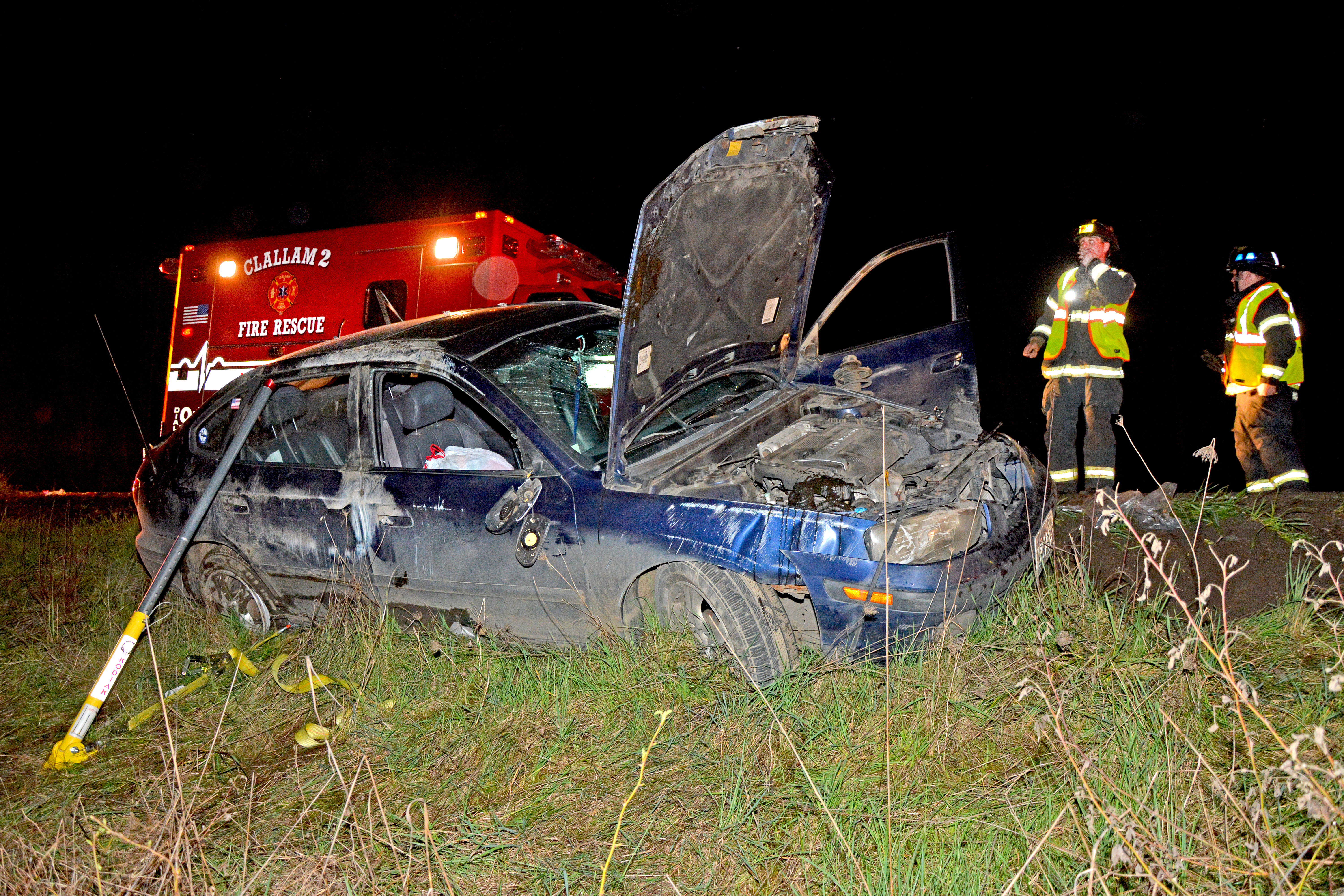 A 19-year-old woman was treated and released Sunday after this rollover wreck near the U.S. Highway 101 intersection with State Highway 112 west of Port Angeles. (Clallam County Fire District No. 2)