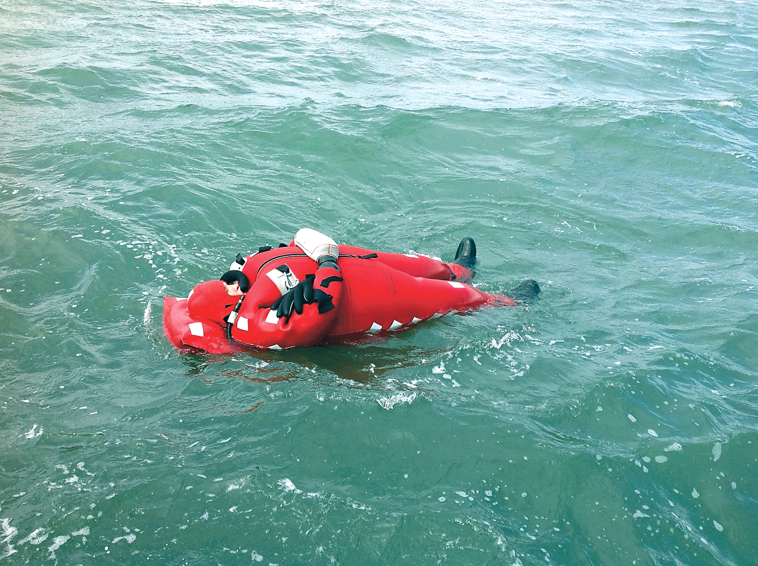 Sequim native Robert Duncan floats in Sequim Bay while wearing a Thermashield 24+ immersion suit he invented to keep commercial fishermen and private boaters alive if they are forced to abandon ship in the frigid waters of the North Pacific or North Atlantic oceans. (Robert Groff)