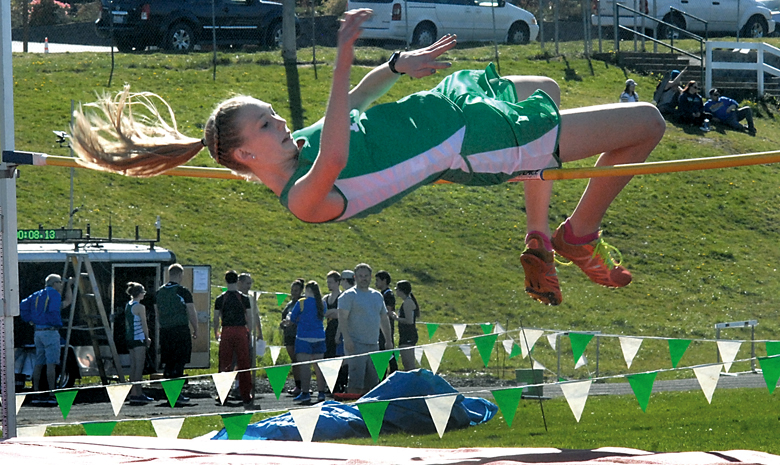 Port Angeles' Gracie Long clears the bar at 5 feet in the girls high jump during the Flying A Retro meet at Port Angeles High School. (Keith Thorpe/Peninsula Daily News)