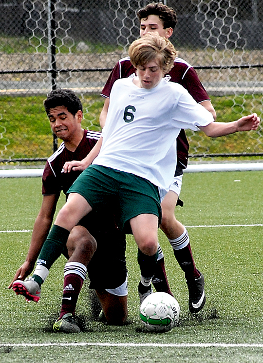 Port Angeles' Ben Schneider steps in front of Ketchikan's Sam Weston