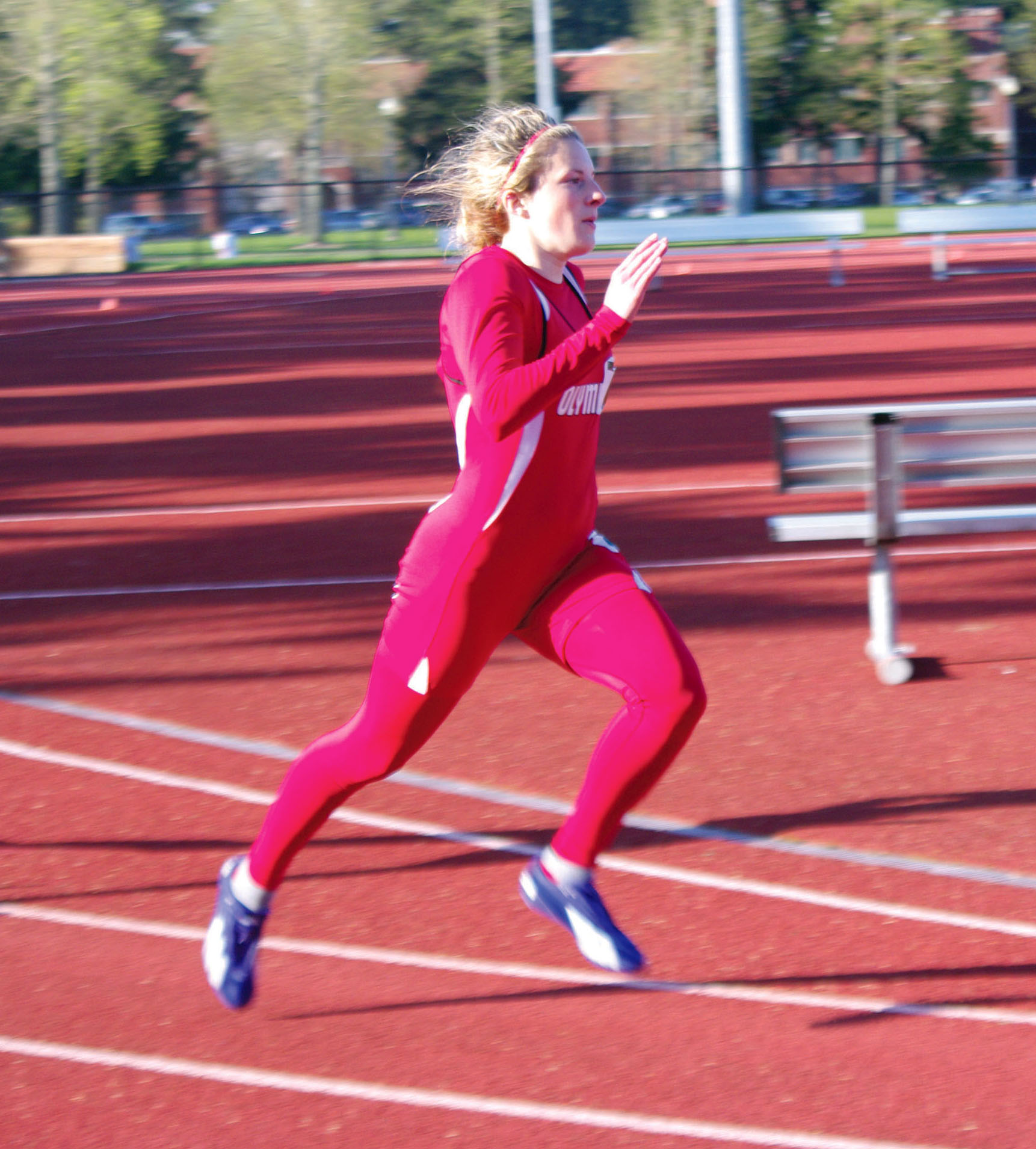 Port Angeles graduate Jolene Millsap runs for Olympic College at the Shotwell Invite. (Dan Dittmer/Olympic College)