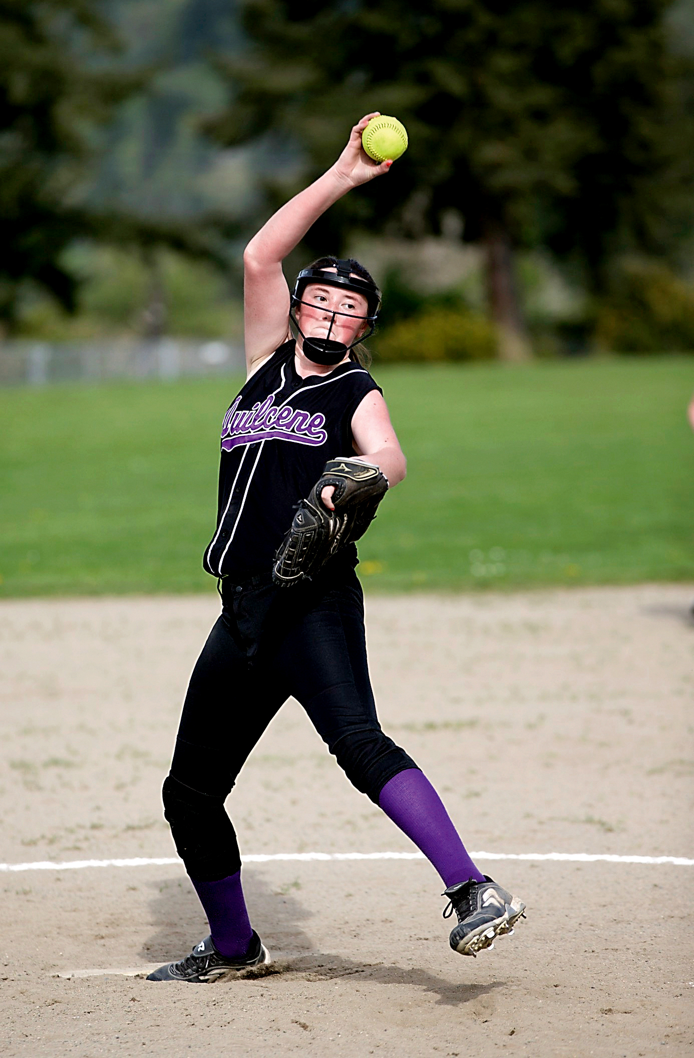 Bailey Kieffer winds up for a pitch during Quilcene's win over Tacoma Baptist. (Steve Mullensky/for Peninsula Daily News)