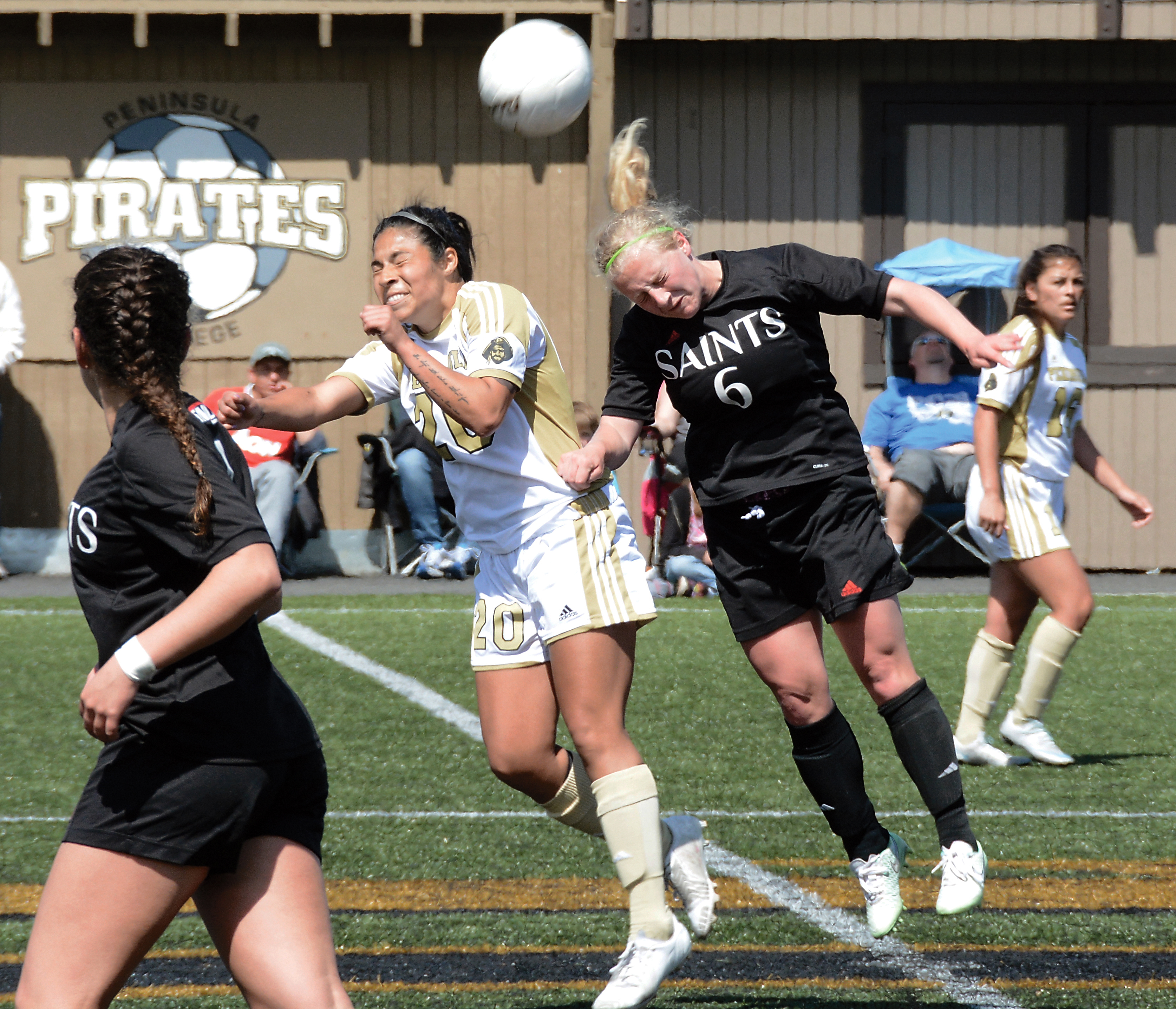Peninsula's Bianca Andrade-Torres and St. Martin's Kari Inch clash on a header attempt at midfield during the Rumble in the Rainforest. (Rick Ross/Peninsula College)