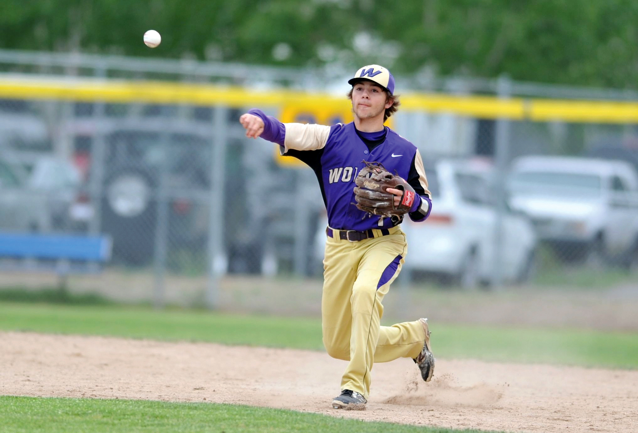 Sequim's Gavin Velarde makes a throw to first base during the Wolves' 5-2 loss to North Kitsap in the district semifinals at Kitsap County Fairgrounds. (Jeff Halstead/for Peninsula Daily News)