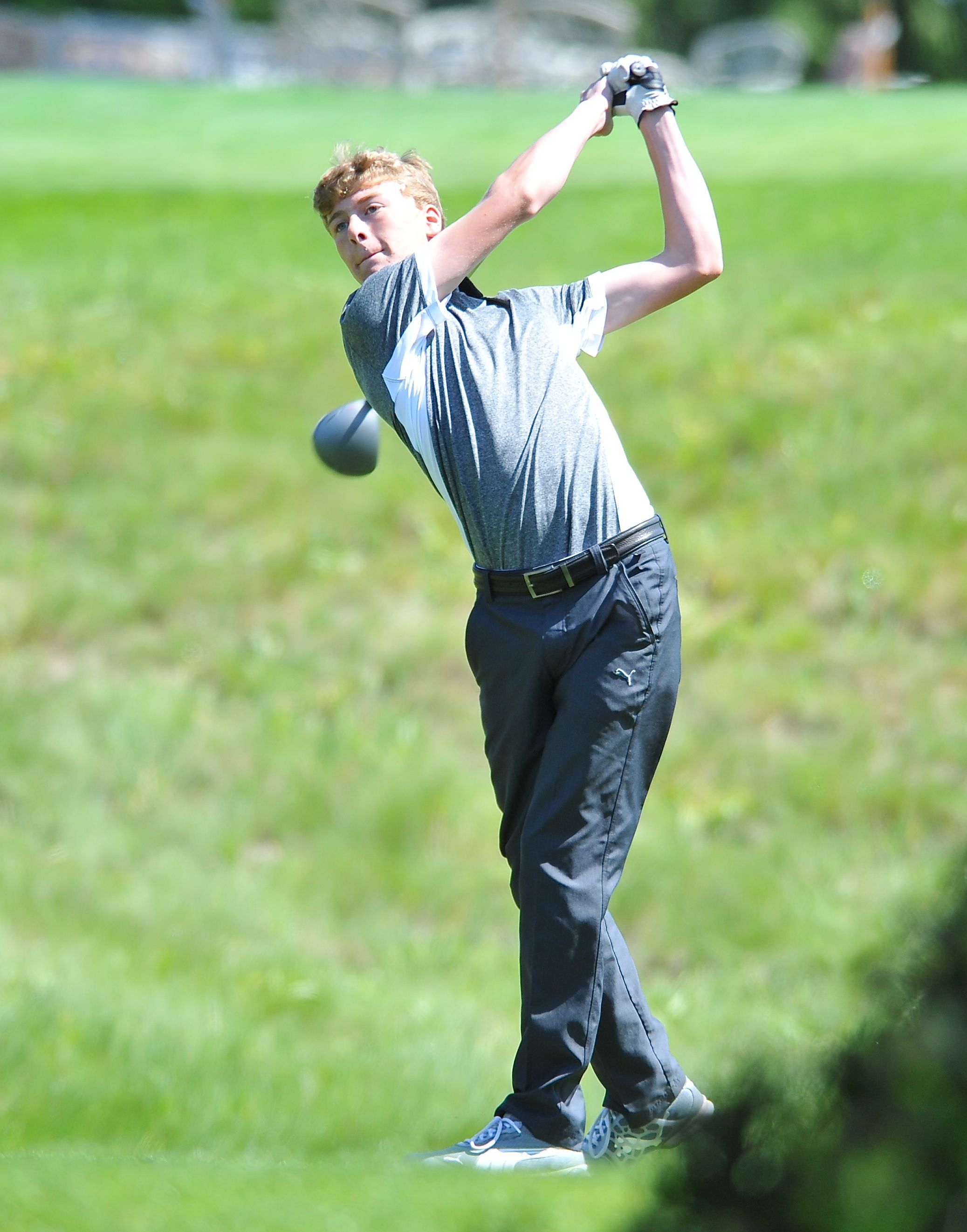 Chimacum golfer Marcus Bufford eyes his drive during the Class 1A West Central District Tournament at Gold Mountain Golf Club in Bremerton on Tuesday. (Jeff Halstead/for Peninsula Daily News)