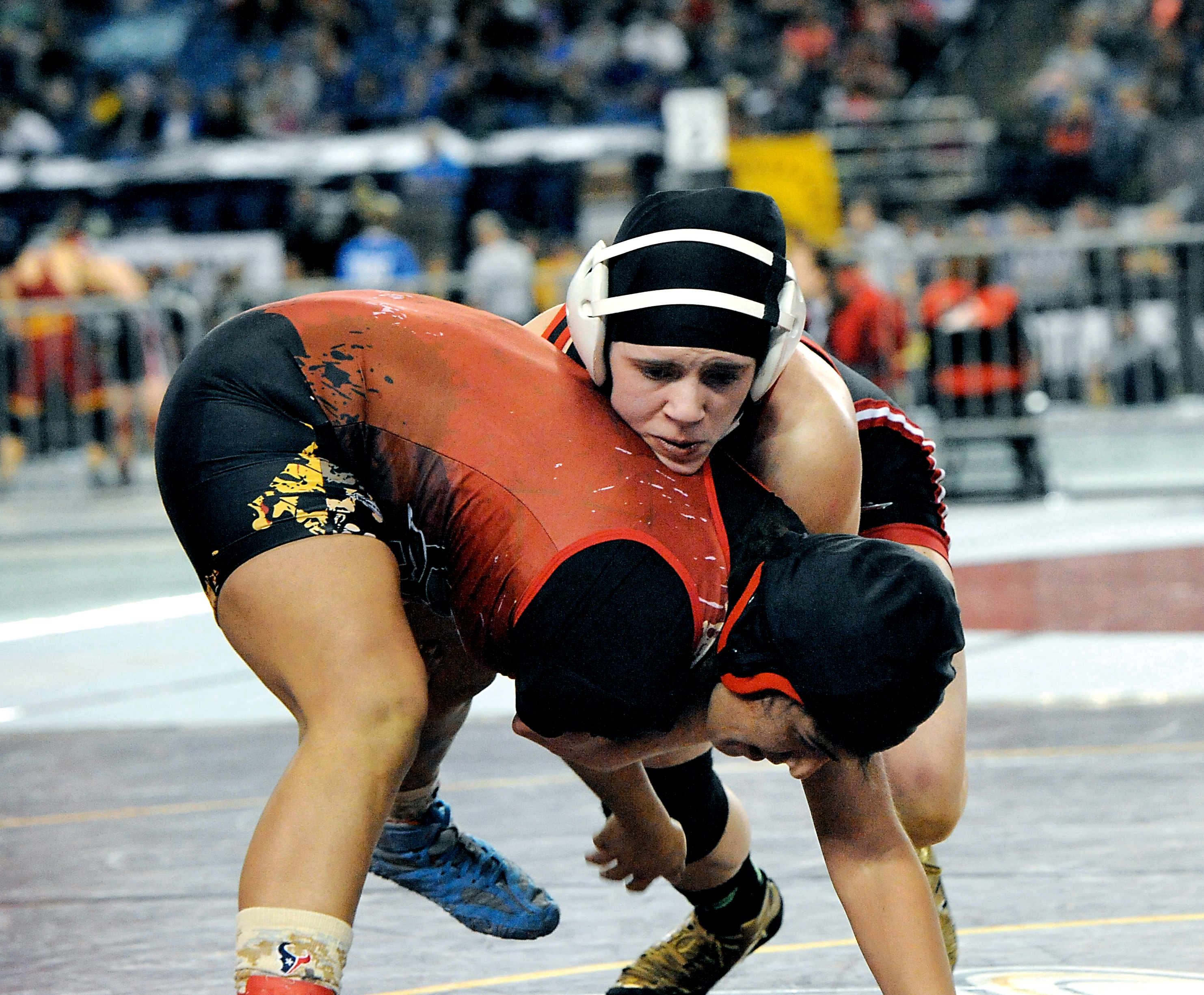 Port Townsend's Chloe Rogers grapples with Steilacoom's Brianna Galvan during the 140-pound state semifinals. Rogers beat Galvan and placed second at state. (Lonnie Archibald/for Peninsula Daily News)