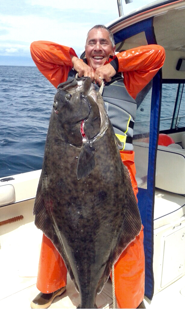 Sequim angler Robert Rohner brought this 85-pound halibut aboard last month off Sekiu. ()