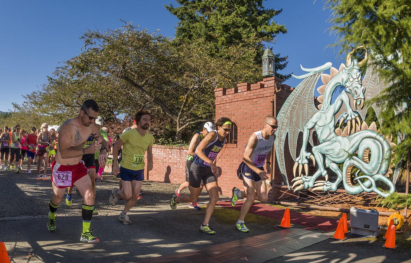 Runners approach the starting line of the 10K and half-marathon at the first-ever Valley of the Trolls runs hosted by Bandy Farms in Sequim on Saturday. The event also featured a 5K race