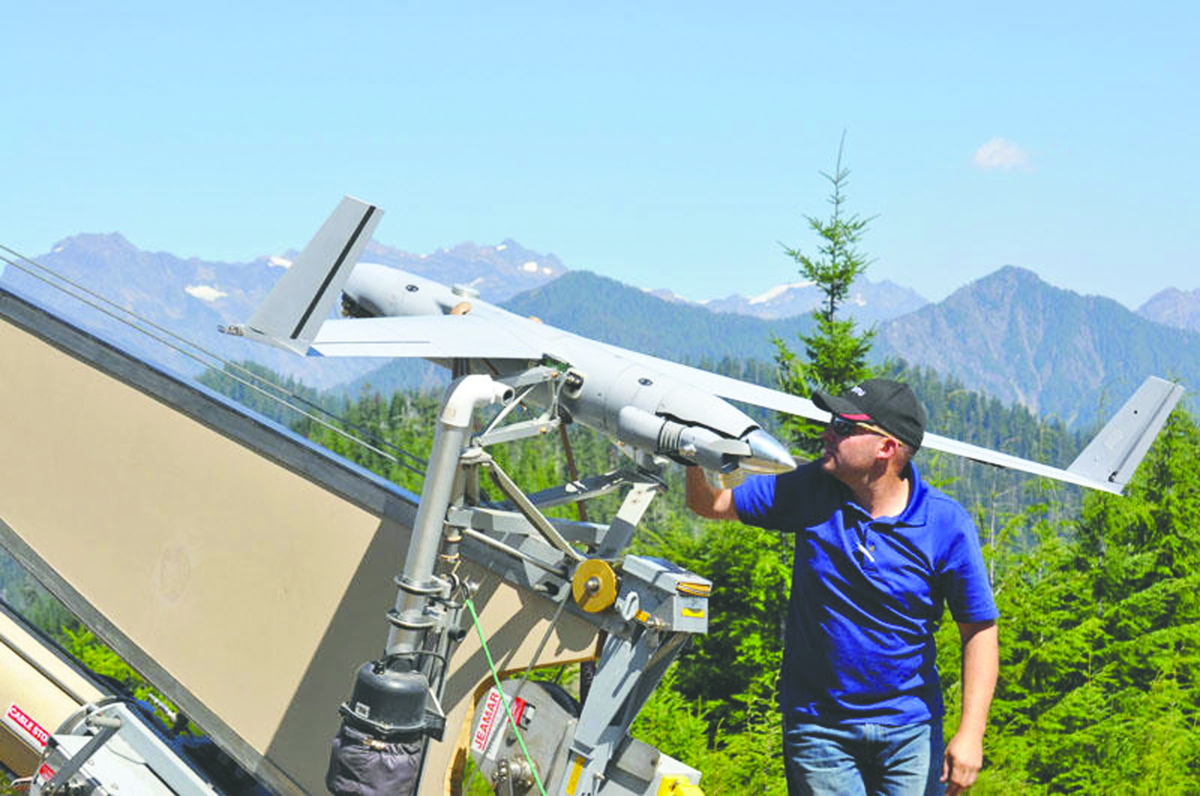 InSitu operator Joseph Cooper prepares the ScanEagle drone for launch to surveil the Paradise Fire in Olympic National Park last week. InSitu