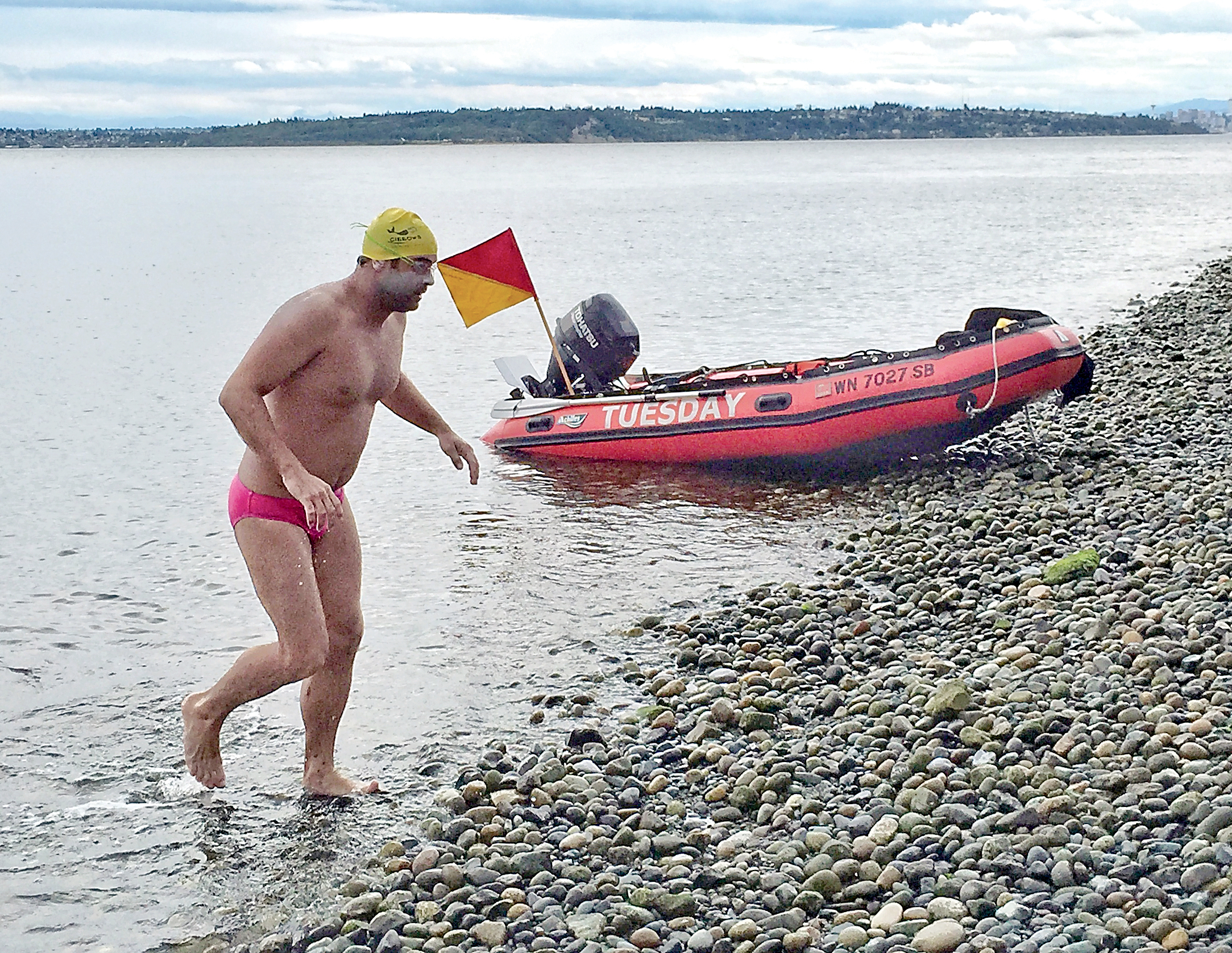Andrew Malinak finishes his swim around Bainbridge Island on Aug 8. Melissa Nordquist