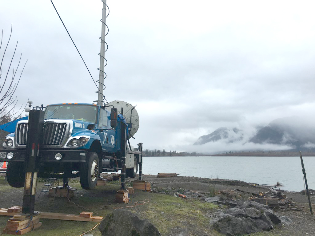 A truck-mounted radar station gathered data on the shores of Lake Ozette from November through Jan. 18. The truck had to be jacked up when the lake rose several feet during December storms and water reached its wheels. (NASA/University of Washington)