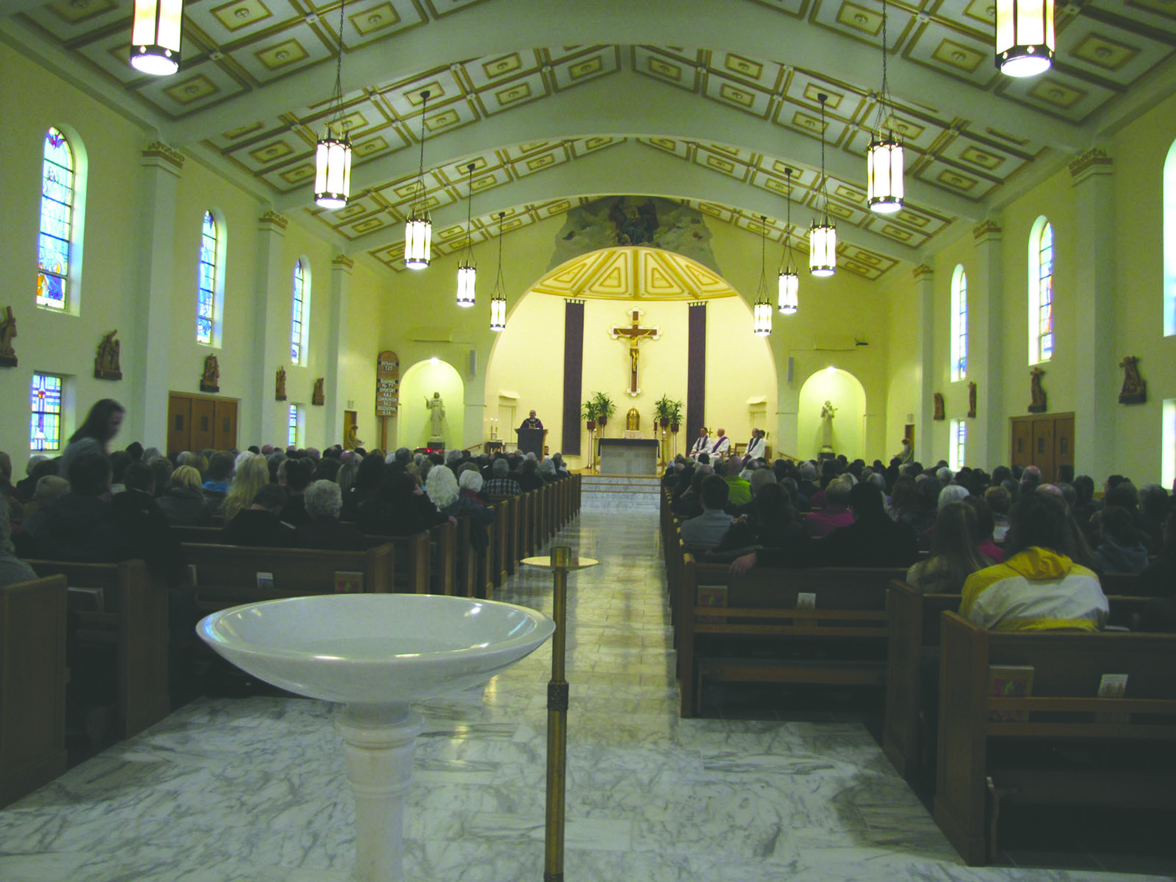 Seattle Archbishop J. Peter Sartain speaks to more than 400 parishioners Sunday at Queen of Angels Parish in Port Angeles during Mass and the dedication for newly completed renovations. (Arwyn Rice/Peninsula Daily News)