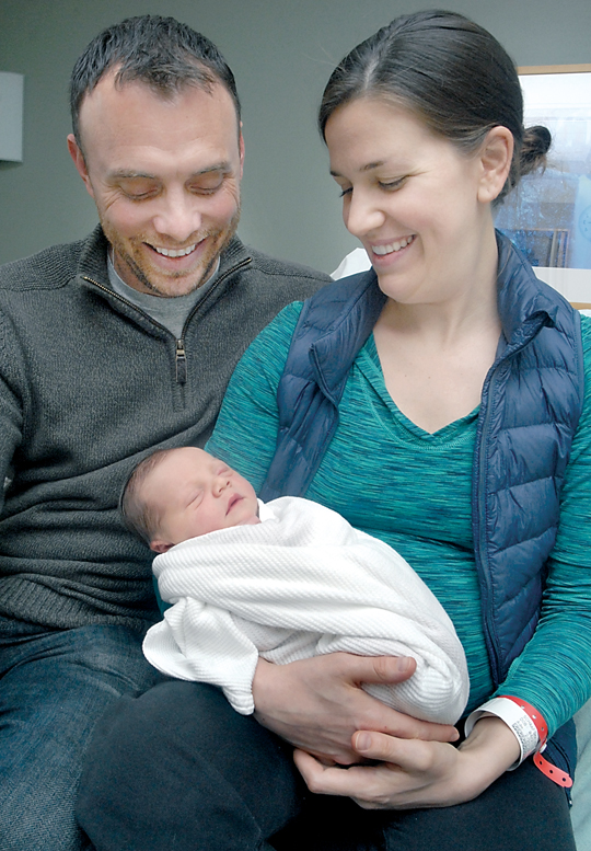 Ryan and Kelin Schaafsma of Sequim admire their newborn infant