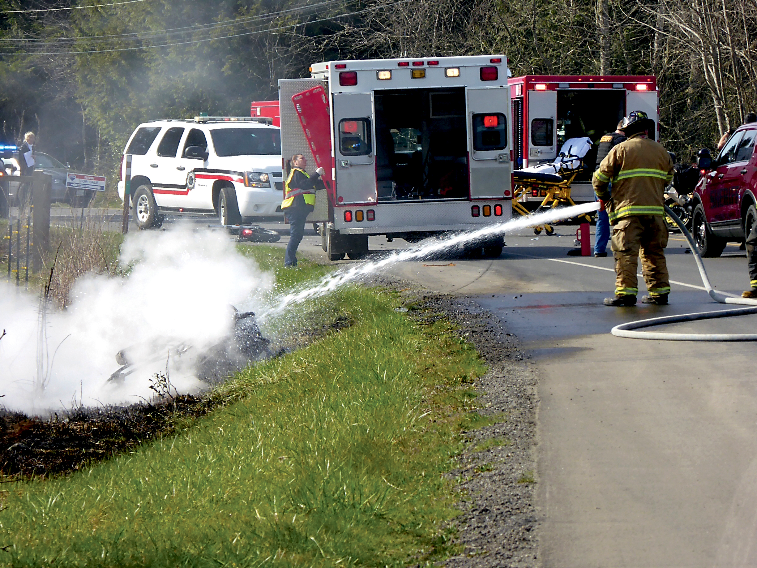 Firefighters put out a motorcycle fire after a wreck on Center Road. ()