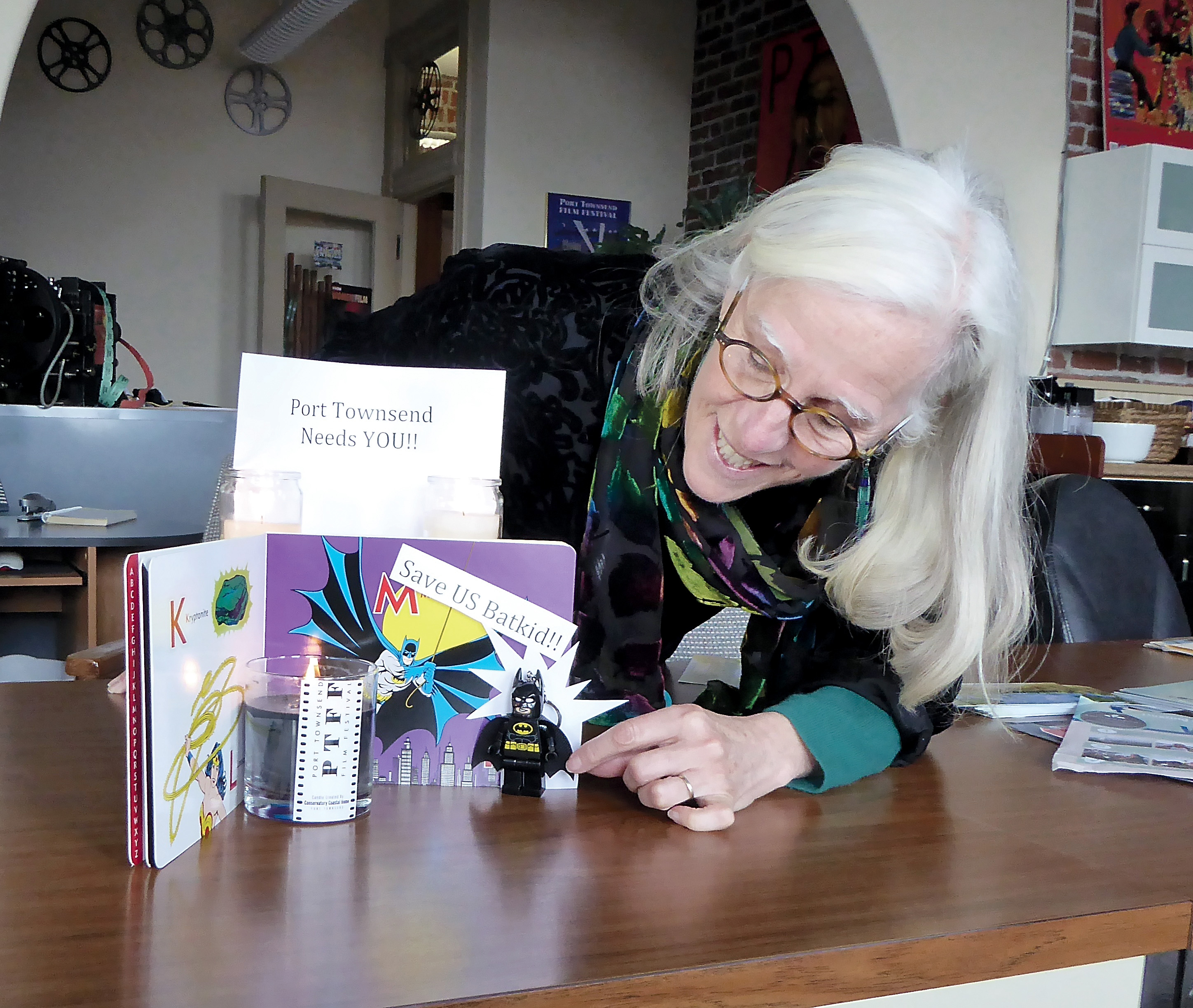 Port Townsend Film Festival Executive Director Janette Force adjusts the props that made up a “shrine” she created when it appeared that next weekend’s Women & Film festival could lose its headline attraction. — Charlie Bermant/Peninsula Daily News ()