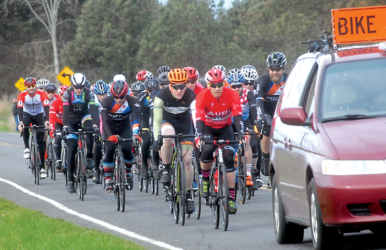 Racers hit the course during last week's first stage of the Tour de Dung Road Race. Racing continues Saturday for part two of the series. (Keith Thorpe/Peninsula Daily News)