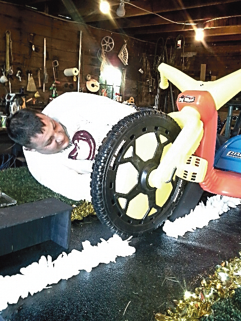 Guy Eldredge works on the 2015 Sequim Irrigation Festival float. (Shawnna Rigg)