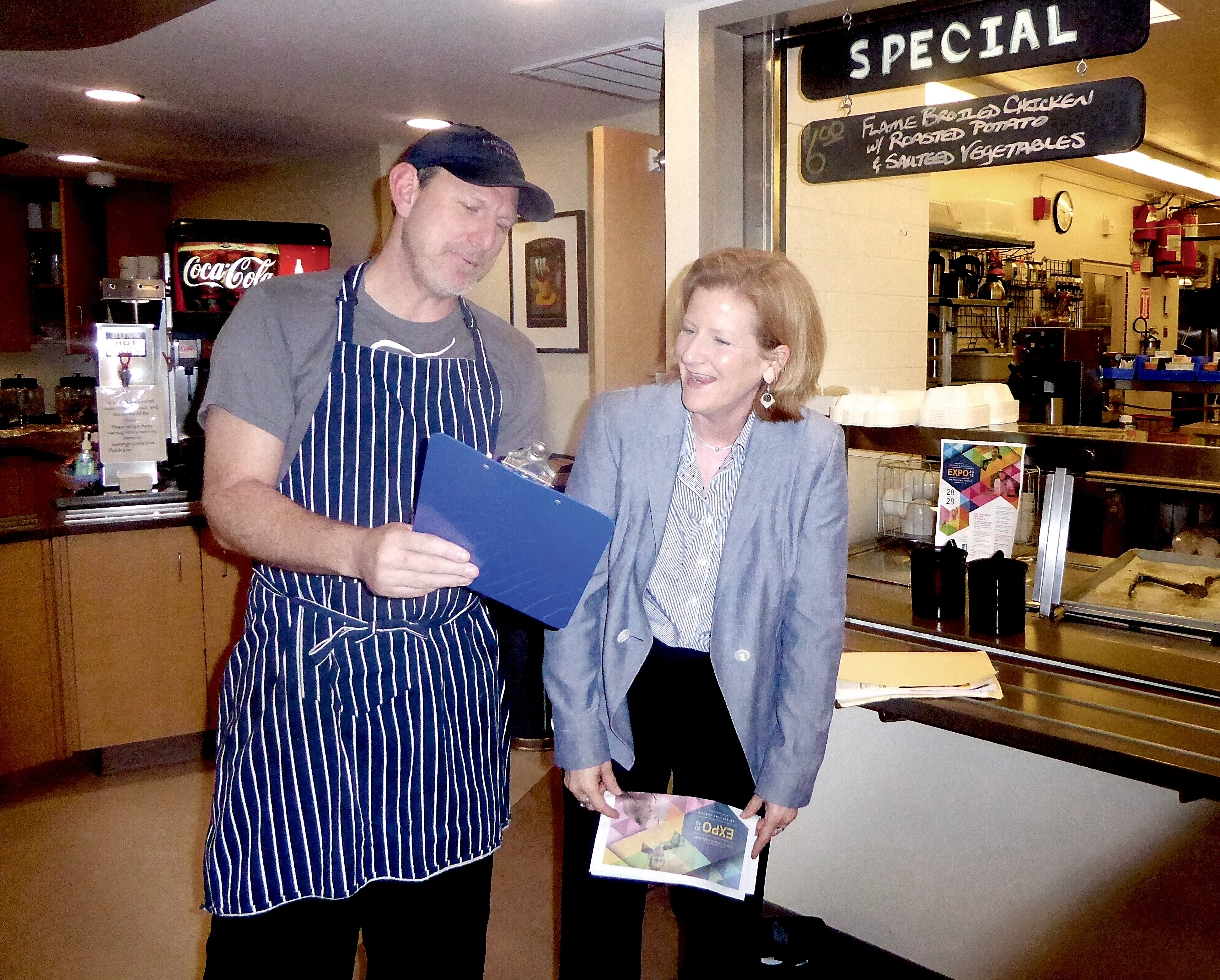 Jefferson Healthcare chef Arran Stark and marketing director Kate Burke go over the last-minute details for Saturday’s Health