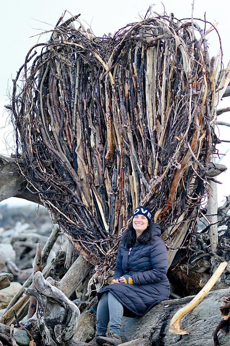 Sahrah Brown of Victoria has constructed a heart of driftwood on windswept Ediz Hook. (Diane Urbani de la Paz/Peninsula Daily News)